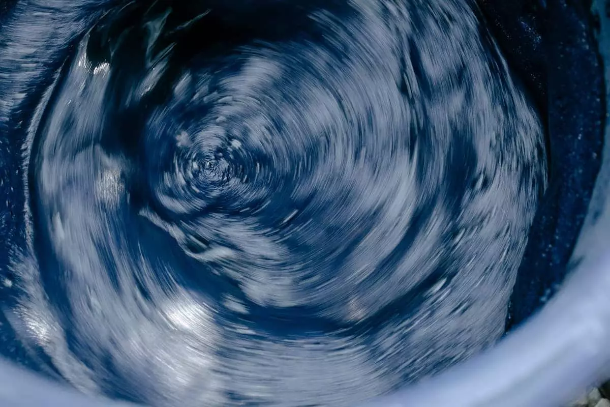 Abstract blue water swirl in motion, capturing energy and flow.