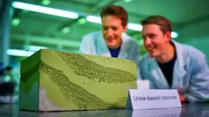 Illustration de la transformation de l'urine en bio-béton durable pour la construction écologique (création par IA, non réaliste). Crédit : Ideogram