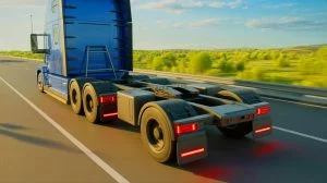 « On électrifie les camions diesel sans changer le camion » : cette invention californienne promet de bouleverser le fret longue distance Illustration de l'innovation d'un dolly électrique intercalé entre le tracteur et la remorque d'un poids lourd, générée par intelligence artificielle.